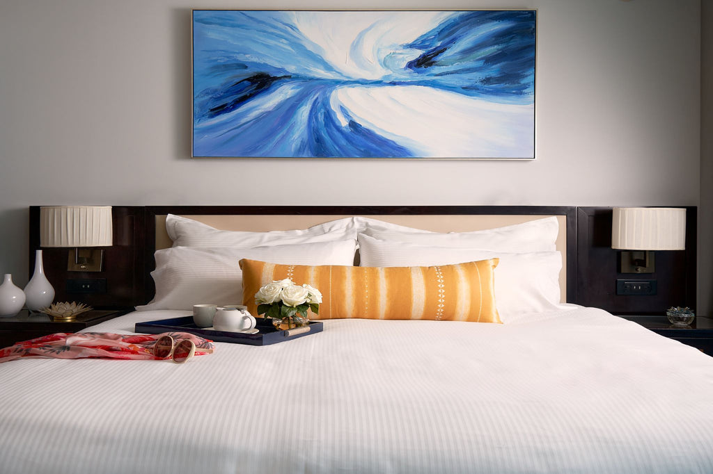 Hotel room bedding made with Thomaston Mills American Luxury tonal stripe lines.